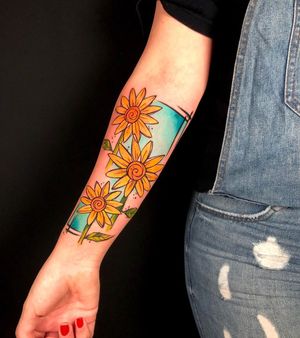 Bright and bold new school watercolor forearm tattoo featuring a beautiful sunflower by artist Sandro Secchin.