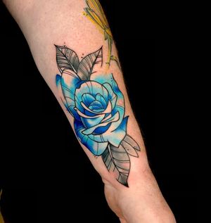 Adorn your forearm with a beautiful new school watercolor flower tattoo by the talented Sandro Secchin.