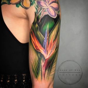 Experience the beauty of realism and watercolor with this illustrative flower tattoo by Raa. Perfect for your upper arm.