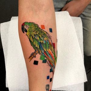 Vibrant new-school watercolor design of a majestic parrot by Sandro Secchin. Brighten up your forearm with this stunning bird motif.