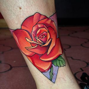 Beautiful neo traditional flower tattoo on lower leg by Max Rodriguez, perfect for a bold and colorful statement.