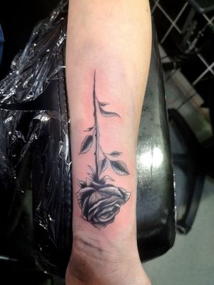 Black and grey rose on wrist