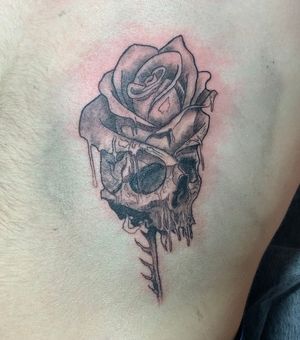 Rose rising on skull 