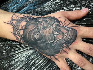 Great panther by Nazariy @kuryliak_tattooer One session of work here! #panther #panthertattoo #handtattoo #blackandgreytattoo #fisttattoo #neotraditionaltattoo #neotraditional #tattoosformen #cooltattoos #brutaltattoo