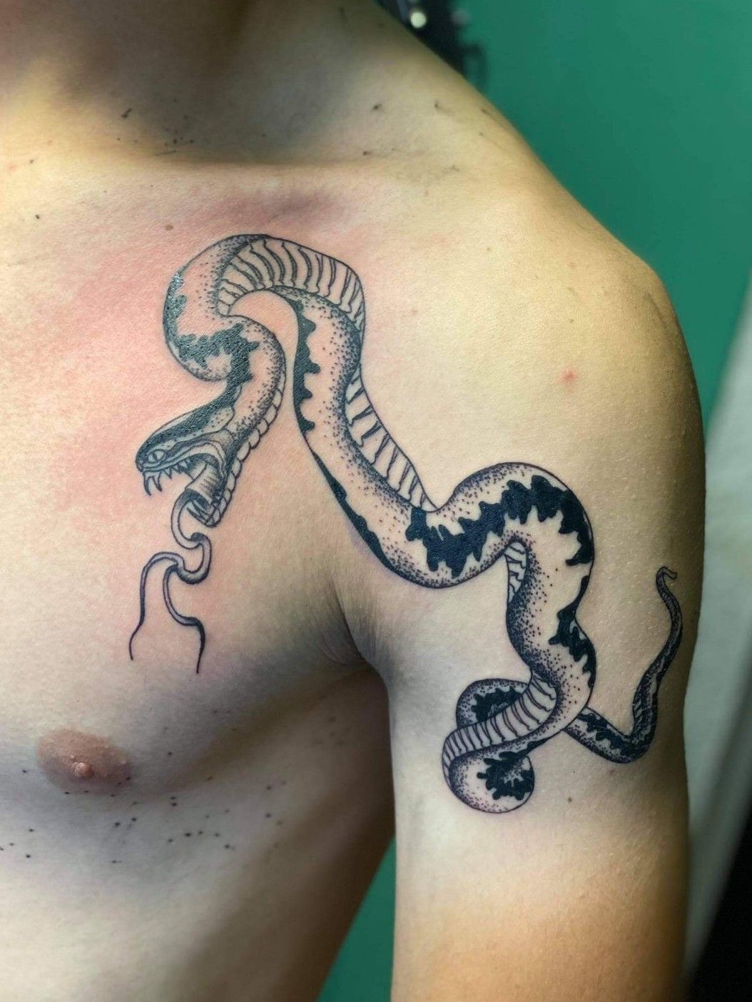 Large snake skeleton tattoo located on the upper arm | Hand tattoos, Snake  tattoo design, Skeleton tattoos