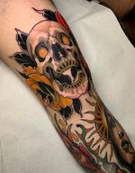 Knee skull tattoo 