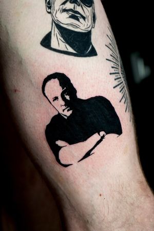 Get a stunning blackwork tattoo featuring iconic Sopranos imagery by the talented artist Miss Vampira.