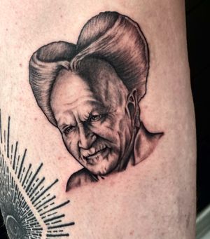 Experience the terror of Bram Stoker's legendary vampire with this haunting black and gray realism tattoo by the talented artist Miss Vampira.