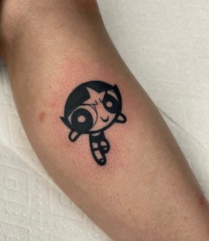Get a playful and detailed black and gray Powerpuff Girls tattoo by the talented artist Miss Vampira. Add some nostalgic fun to your ink collection!