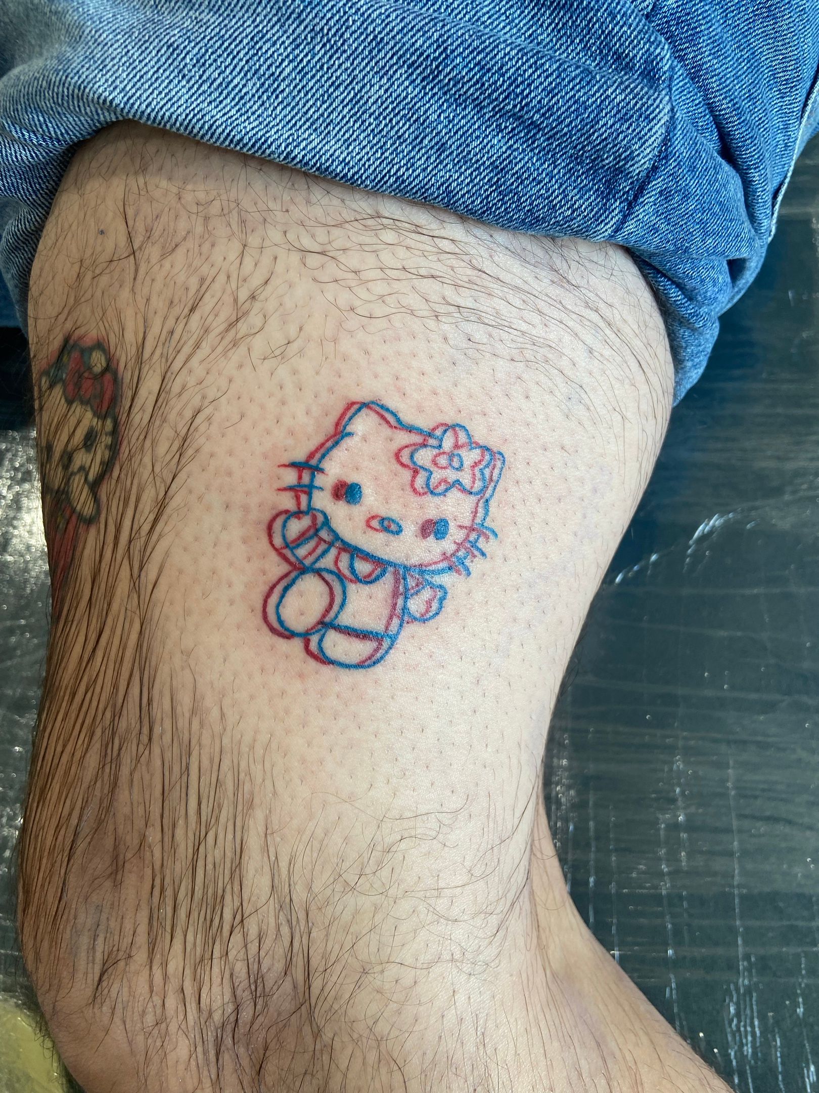 Paw prints & Hello Kitty tattoo