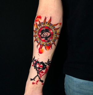 Vibrant watercolor design of an eye on the forearm, by artist Sandro Secchin. Bold colors and modern style.