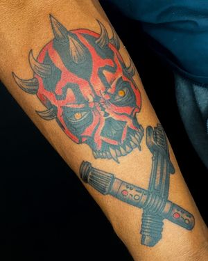 Darth Maul and cross sabers on melanated skin. 