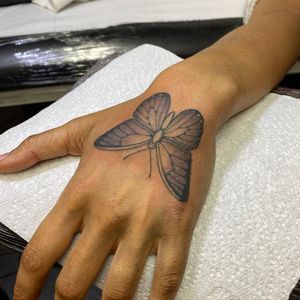 Elegantly designed black and gray butterfly by Sophie Rose Hunter, featuring fine line details. Perfect for showcasing on your hand.