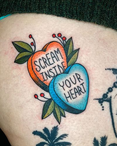 The best mantra of 2020. Two candy hearts with "SCREAM INSIDE YOUR HEART" written in print. 