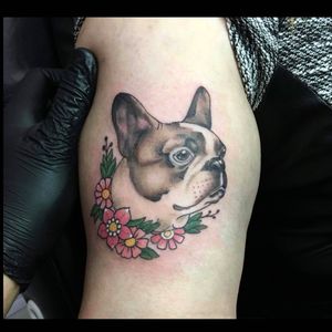 Get inked with Frankie Brown's stunning neo-traditional design featuring a dog and flower motif on your upper arm!