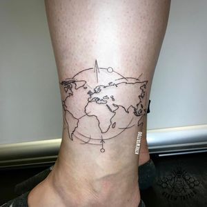 Fineline World Map Outline Tattoo by Kirstie @ KTREW Tattoo - Birmingham, UK #finelinetattoo #worldmap #tattoo #ankletattoo #linework #tattoos 
