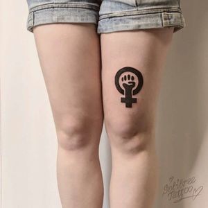 Symbol of the feminism on girl’s hip