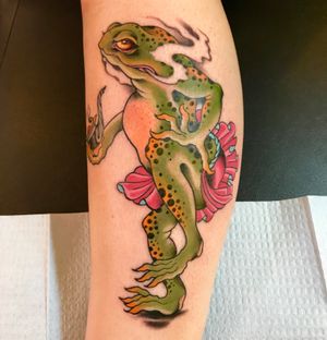 Unique lower leg tattoo by Darren Brass featuring a frog and toad smoking pipe in traditional Japanese style.