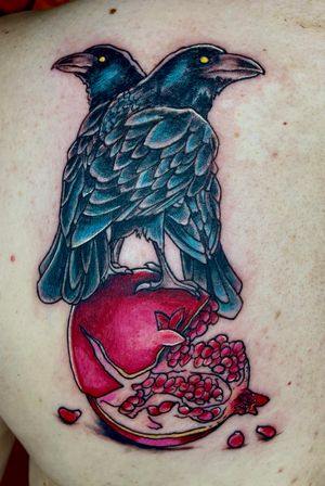 Custom ravens sitting on a pomegranate 