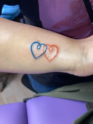 Teeny, tiny, color hearts!Done at Modern Day Martyrs off Southwest 6th Street in Amarillo, Texas.