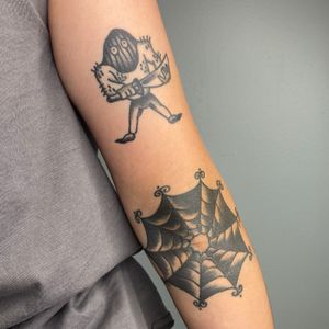 healed black and grey executioner spider web traditional tattoo