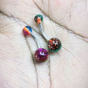 Belly button ring available.