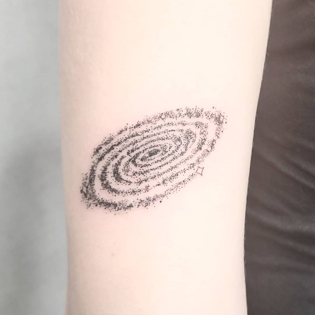 minimalist tattoo milky way galaxy