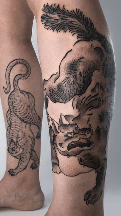Tiger on the right leg - 1,5 years healed, wolf on the left - fresh