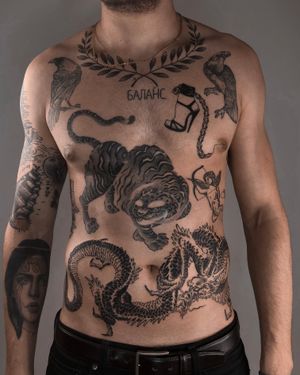 Experience the intricate beauty of Japanese black and gray tattoos by FKM TATTOO featuring a stunning combination of bird, tiger, and dragon motifs on the chest.