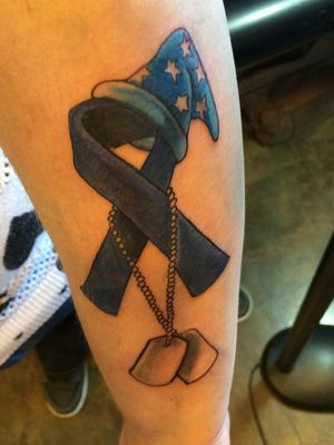 My Huntington’s Disease Awareness tattoo. The Mickey sorcerer hat represents my sister and the dog tags represent my brother. I am looking to add to this 