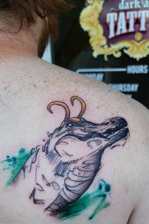Alligator loki #watercolortattoo #texasartist #inkedchick #ladieswithtattoos #tattoo #cooltattoos #realism #illustration #alligatorloki #loki 