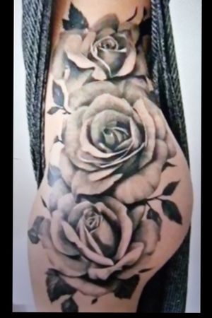 rose outer thigh tattoos