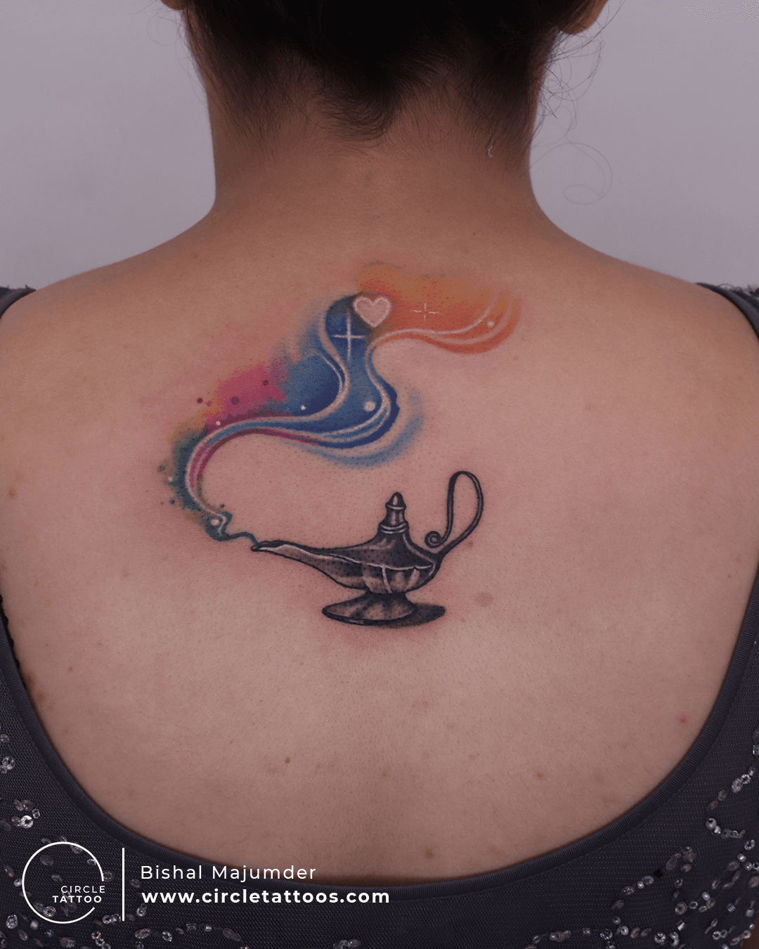 Genie lamp tattoo on the left side ribcage.
