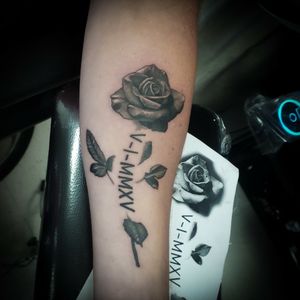 Rose tattoos are always classy designs to do. 