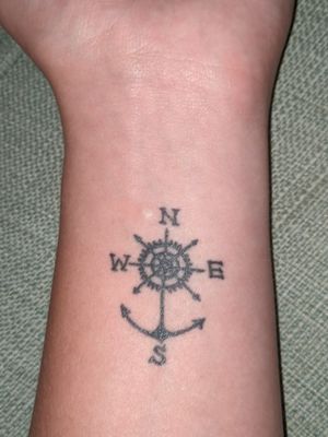 Third tattoo, anchor/compass left wrist
