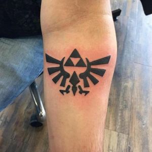 Triforce from Zelda. I want this one above my Egyptian tattoo. 