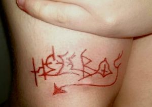 Hellboy knee tattoo