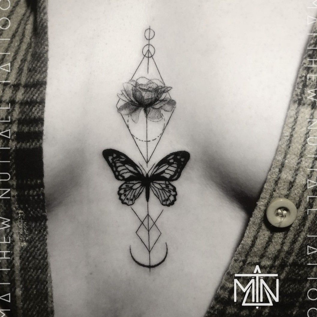 Geometric butterfly sternum tattoo