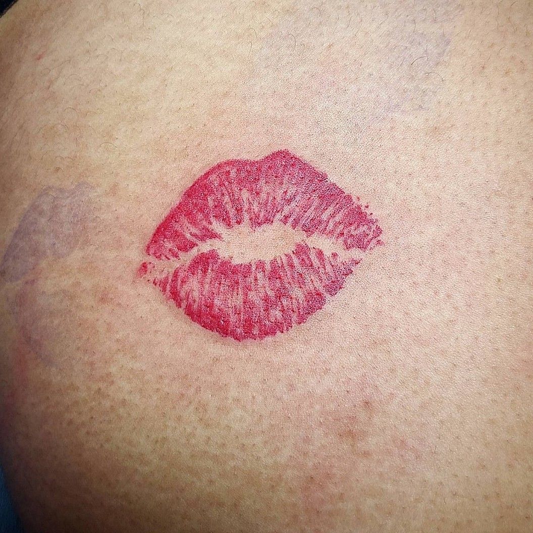 Kiss butt tattoo