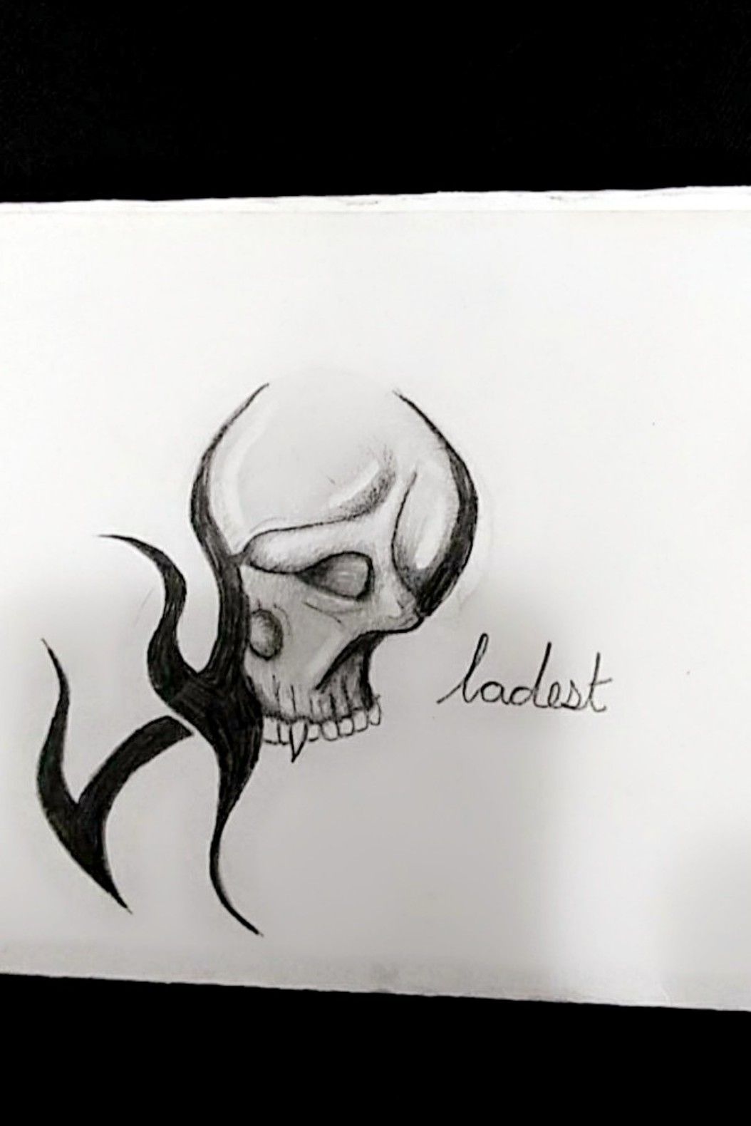 drawings of tribal skulls with flames