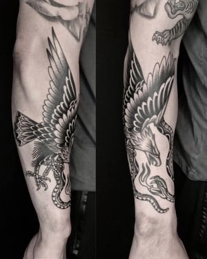 Black and grey eagle and snake wrapping the right forearm. 