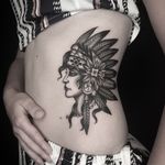 Black and grey native lady head on the ribs