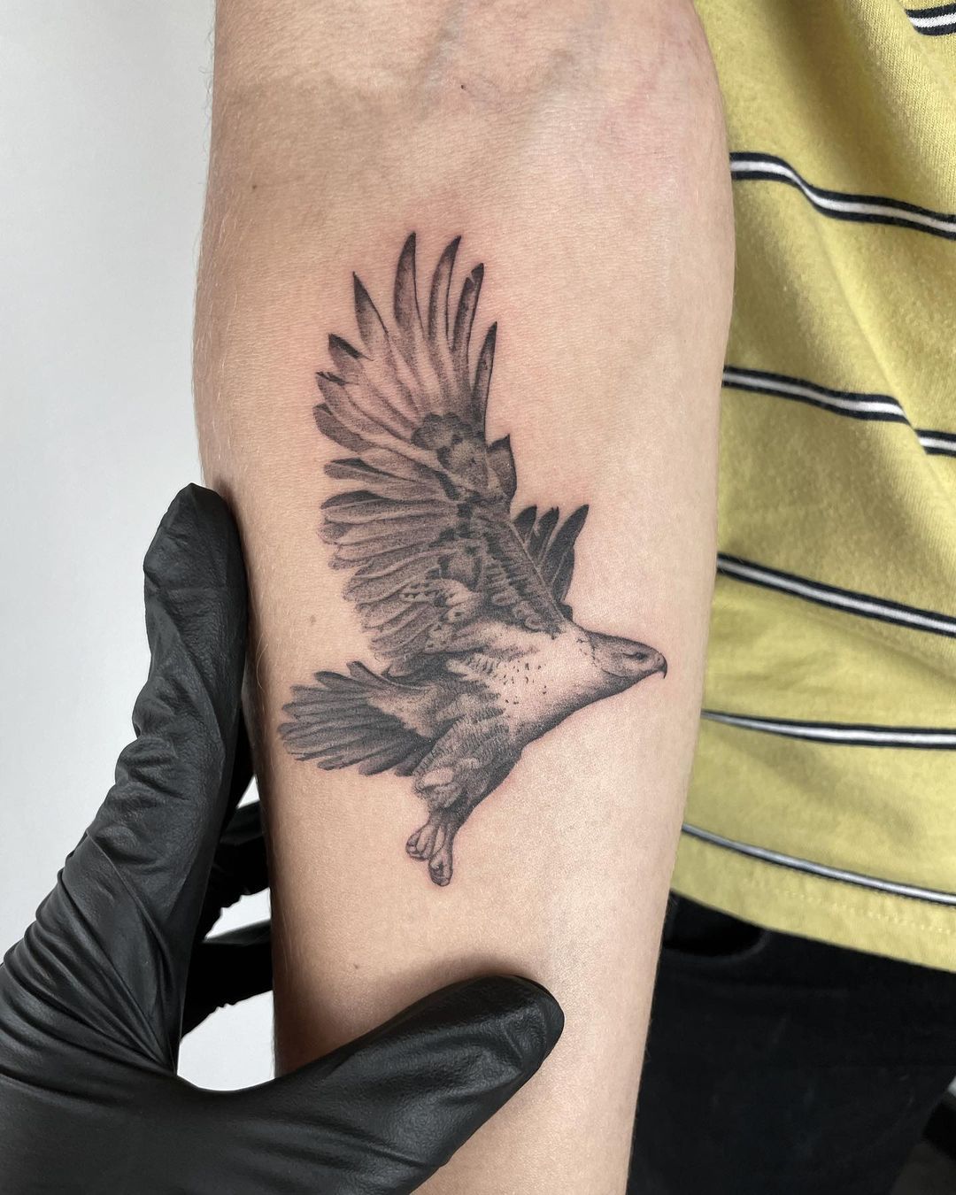 red tailed hawk tattoo by Ty McEwen TattooNOW