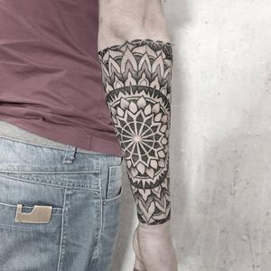 Some mandala style tattoos? This one was made by Ada