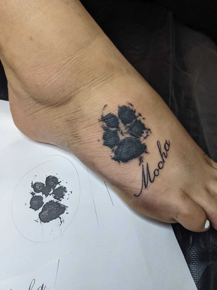 dog paw print tattoo on wrist