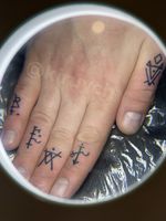 Celtic runes on fingers 
