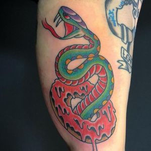 Snake and a donut #traditionaltattoos #colortattoo #snaketattoo #traditional #donuttattoo #legtattoo 