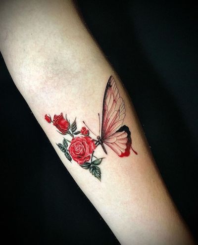 Capture the beauty of nature with an illustrative butterfly and flower tattoo on your forearm in LA.