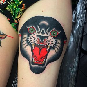 Get a fierce and timeless panther tattoo on your upper leg, expertly done by renowned artist Andrea Furci.