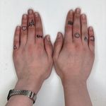 Set of mini tattoos on fingers 